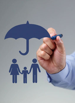 A person drawing an umbrella over their family.